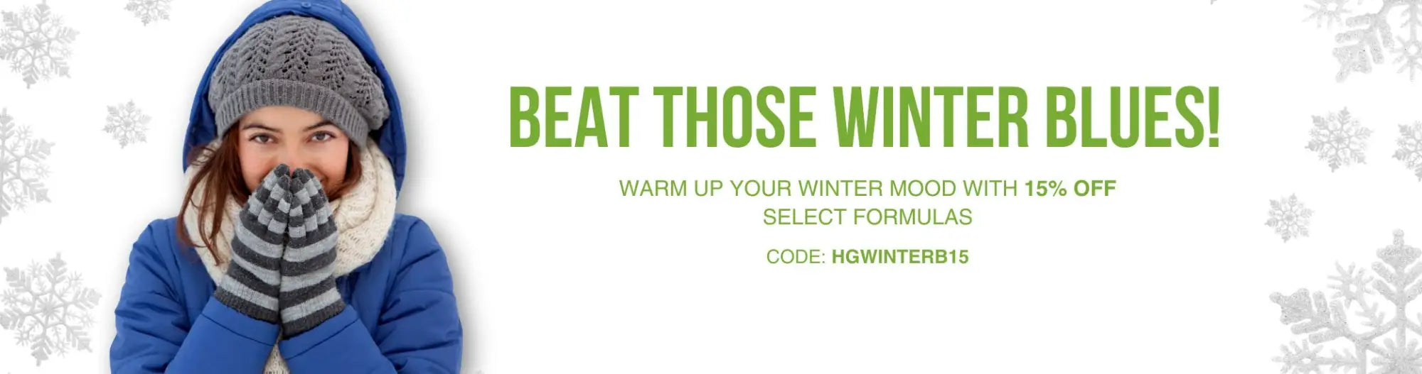 Woman in blue winter coat beating winter blues with cozy gray hat, hood, striped gloves