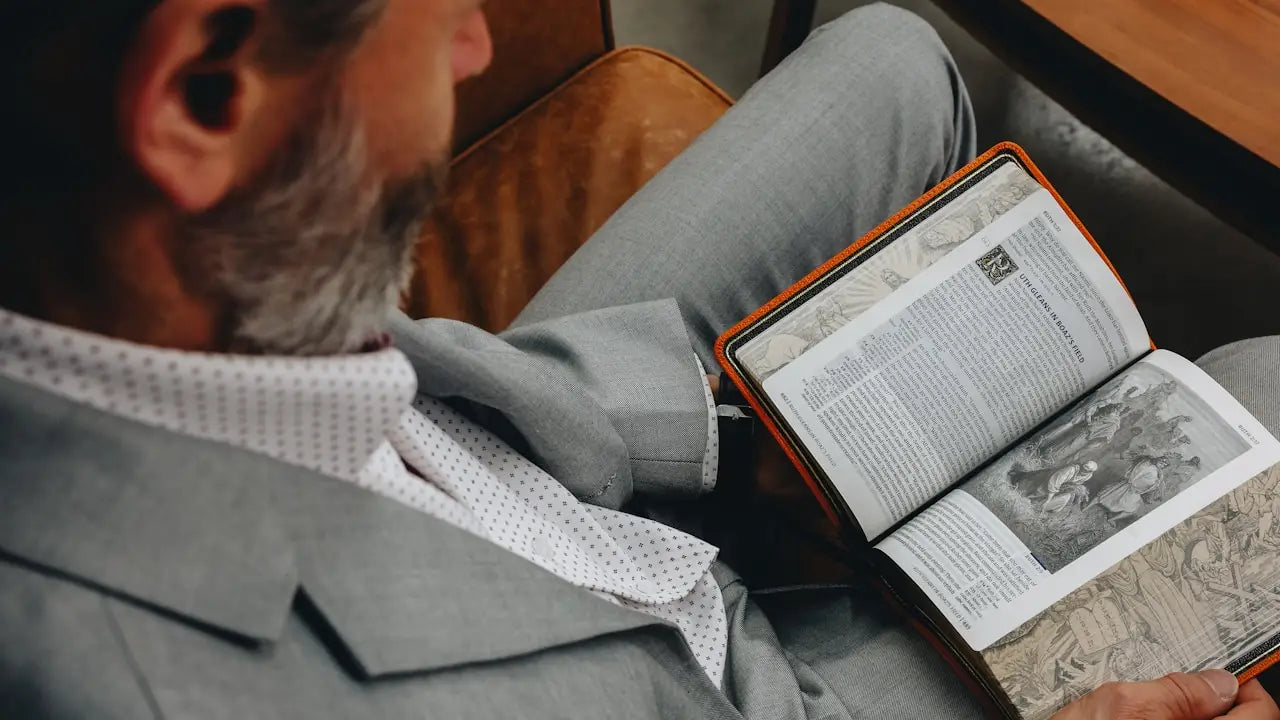 person reading herbal headlines and medical studies about graviola on tablet
