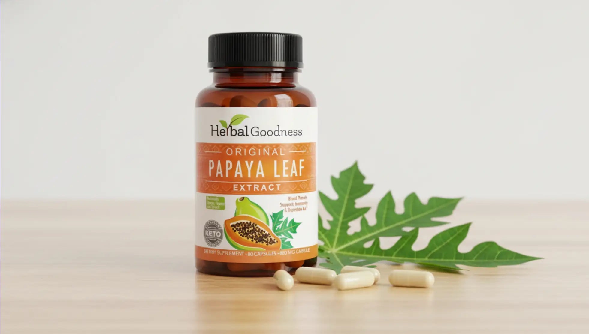 A brown glass bottle of herbalgoodness original papaya leaf extract with a black cap, featuring an orange and white label adorned with papaya imagery.